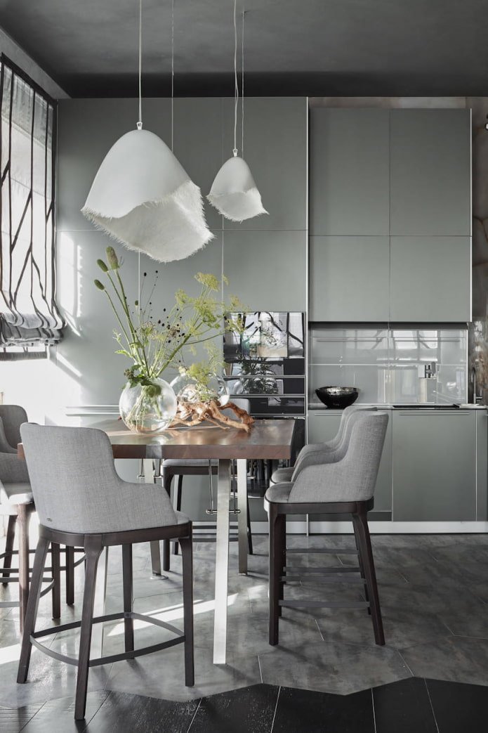 beautiful plant decor and textile lampshades in a gray and white kitchen