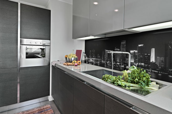 scaping with views of a night metropolis in a gray and white kitchen