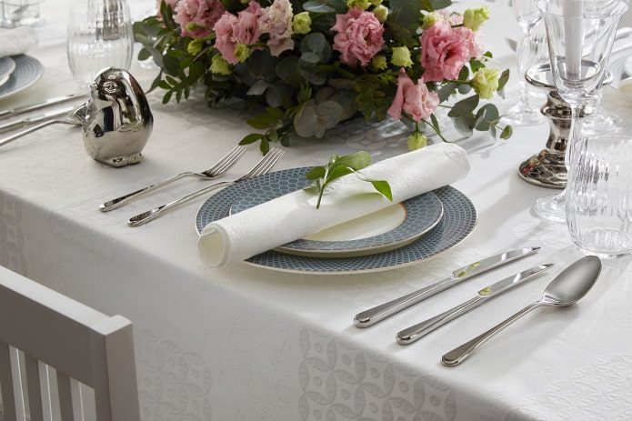knives and forks in table setting