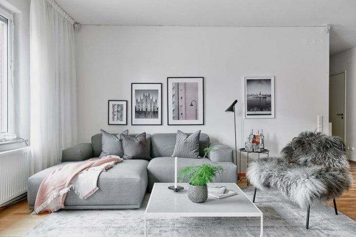 white walls with a gray sofa