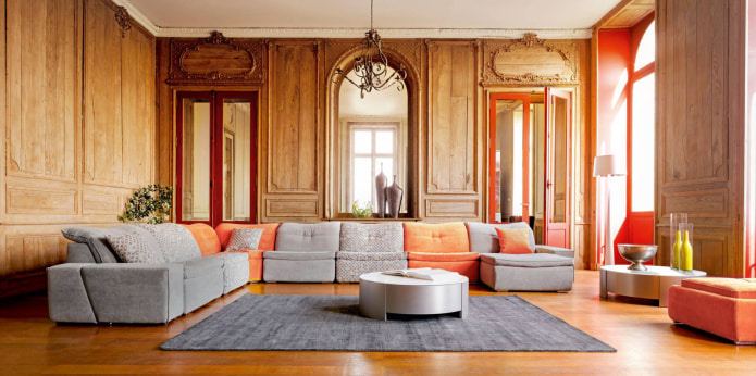 sofa with orange pillows