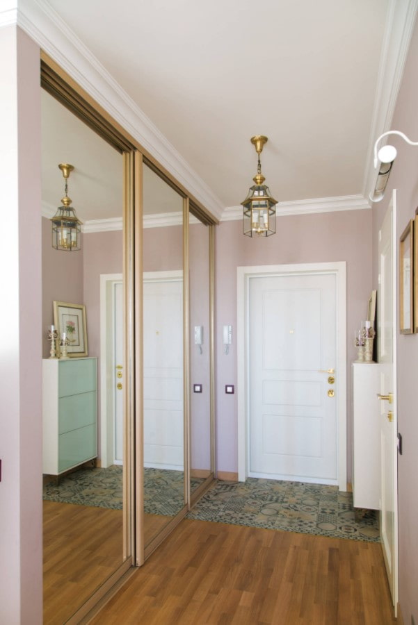 mirrored facades of the sliding-door wardrobe