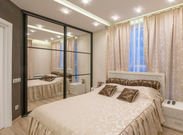 wardrobe with mirrored façade in bedroom interior