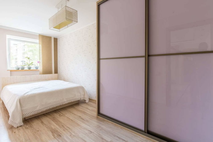 lilac-colored wardrobe in the bedroom interior