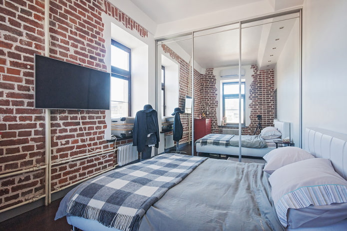 wardrobe in the interior of a loft-style bedroom