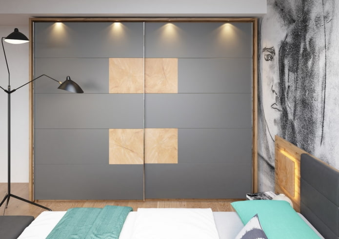 a sliding wardrobe with lighting in the bedroom interior