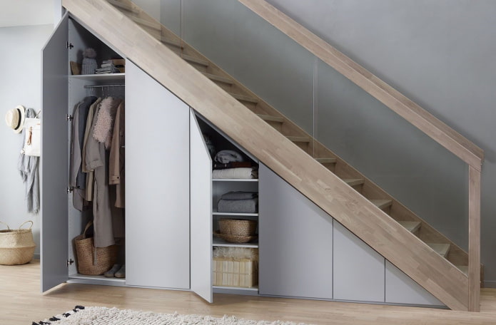wardrobe with hinged doors under the staircase
