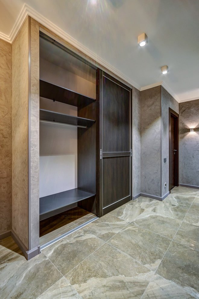 filling of a sliding wardrobe in the interior of a hallway