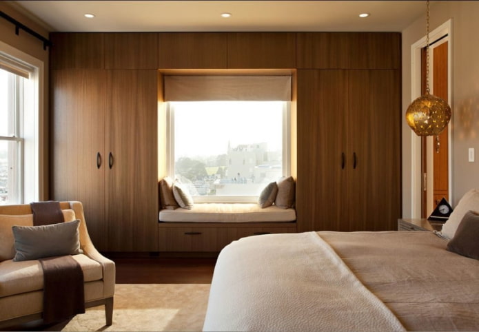 cabinets around the window in the bedroom interior