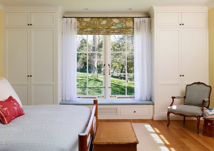 cabinets around the window in the bedroom interior