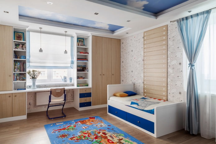 cabinets around the window in the interior of the nursery