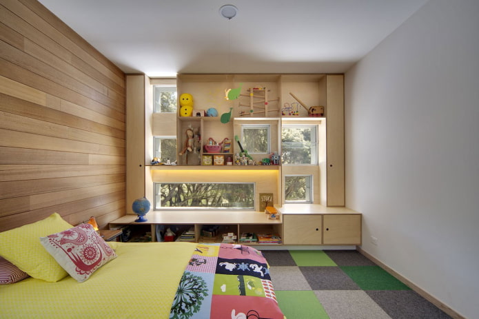 cabinets around the window in the interior of the children's room