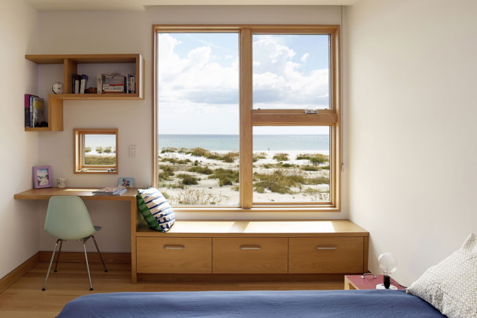 wardrobe below the window in the interior