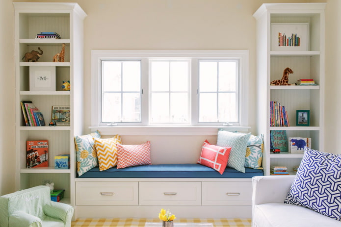 wardrobe with sofa around window in interior