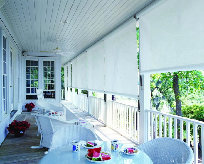 veranda with white roller blinds