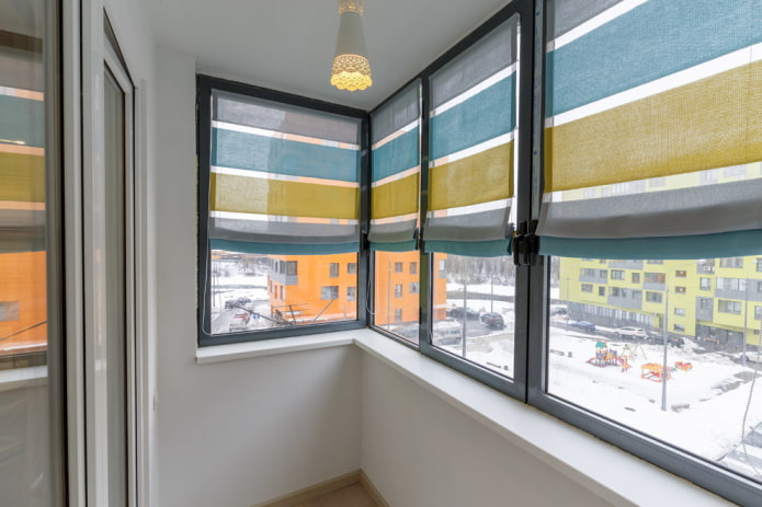Striped Roman blinds on the loggia