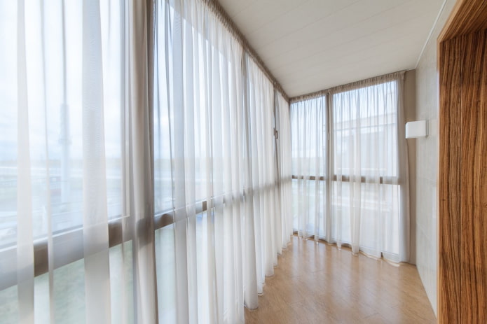 white curtains in the balcony interior