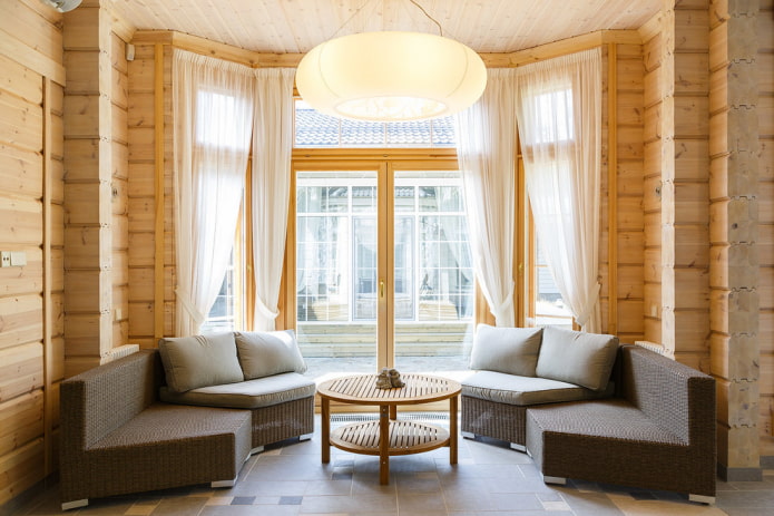 curtains on the bay window in a wooden house