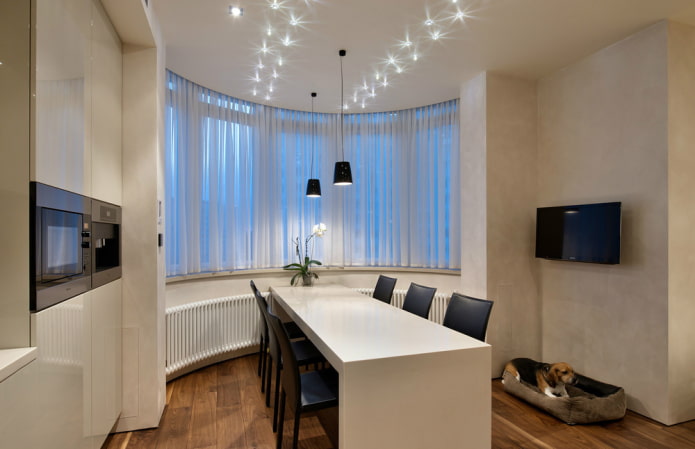 short curtains on the bay window opening in the kitchen