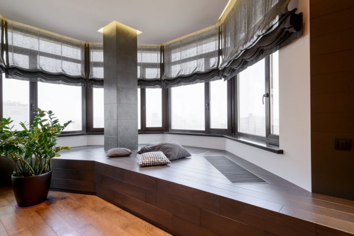 curtains on a polygonal bay window opening in the interior