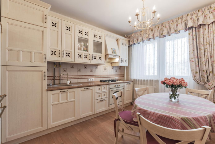 balcony opening with curtains in a kitchen in the Provence style