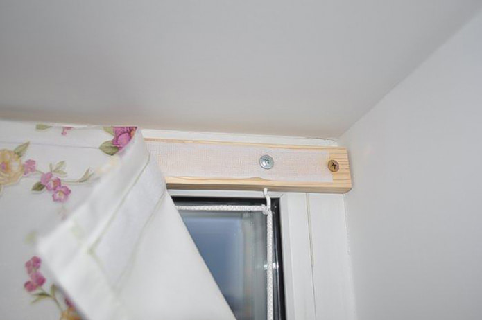 attach sticky tape to a wooden rail