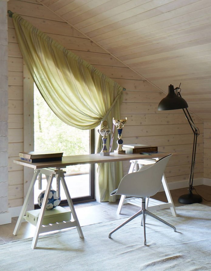 curtains on a dormer window with a slanted ceiling