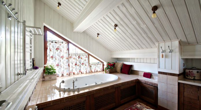 attic bathroom with a window