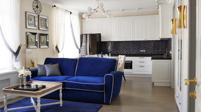 blue sofa in the kitchen-living room interior