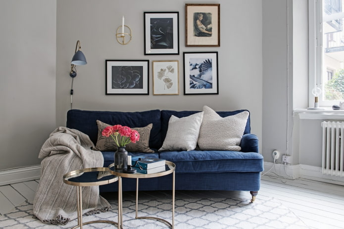 gray walls and a blue sofa