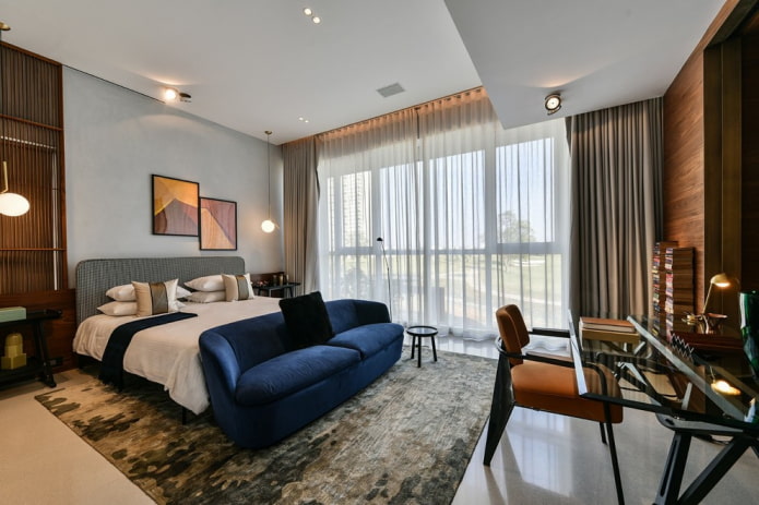 blue sofa in the bedroom interior