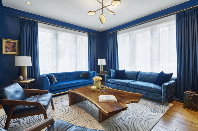 blue sofas combined with a carpet