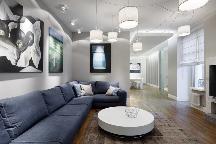 blue sofa in a gray living room