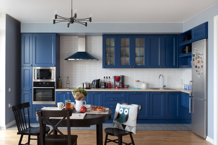 dining area in the kitchen interior in blue tones