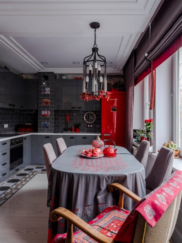 red refrigerator and gray furniture