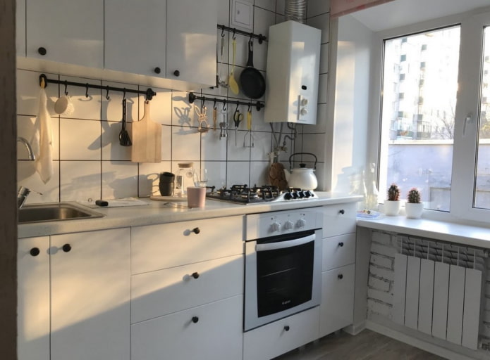 white kitchen with a boiler
