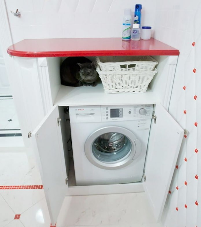 Washing machine in a cabinet