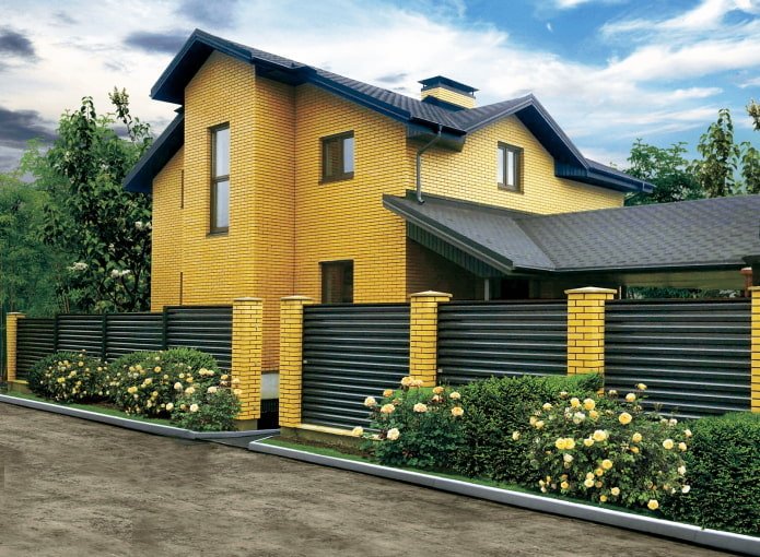yellow brick house with a dark green roof