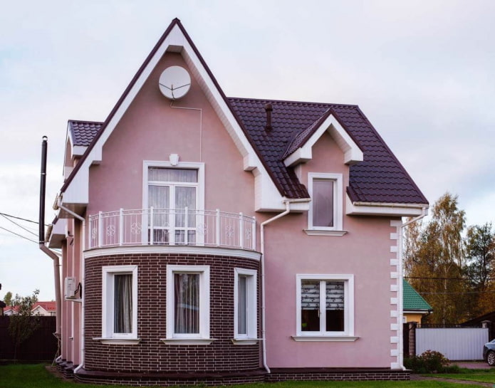 pink house with a cherry roof