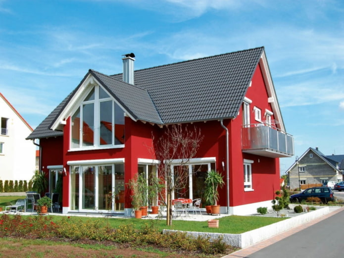 red house with a black roof