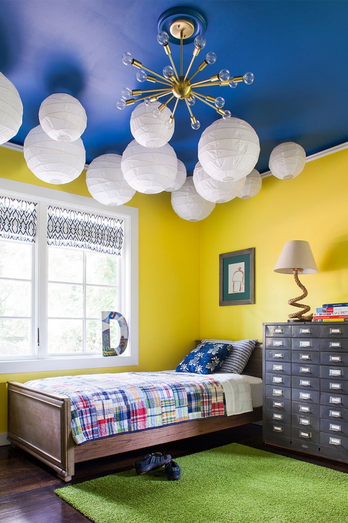 a bright child's room with a blue ceiling