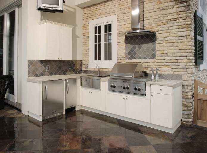 decorative stone and glossy floor tiles in the kitchen interior
