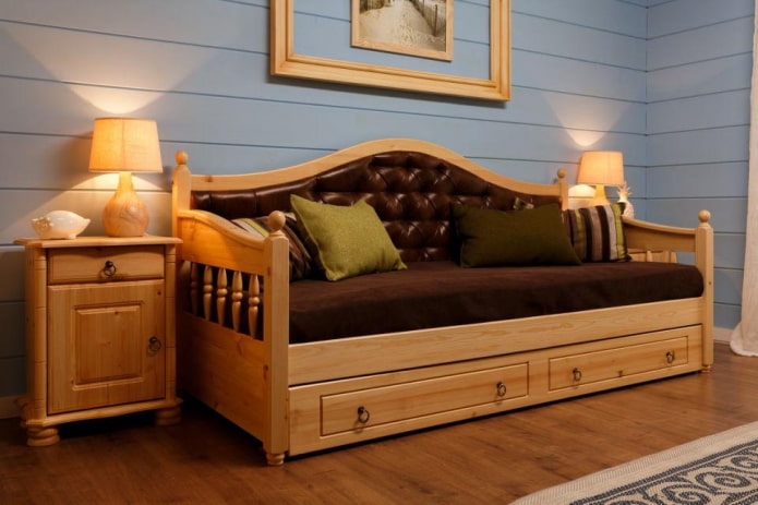 sofa with wooden armrests in the interior