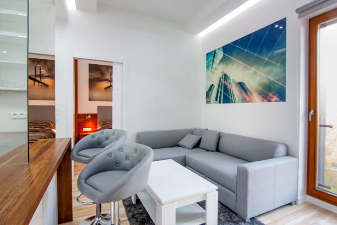 Interior of a combined kitchen-living room with a bar counter
