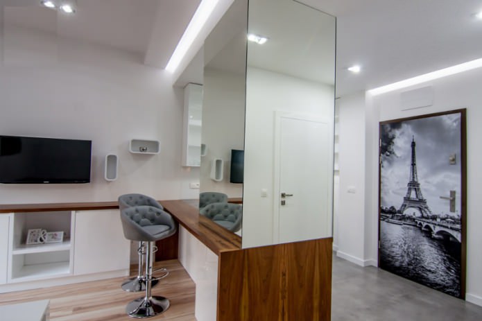 Interior of a combined kitchen-living room with a bar counter