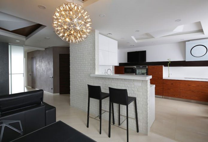 Bar counter with brick finish between the kitchen and living room