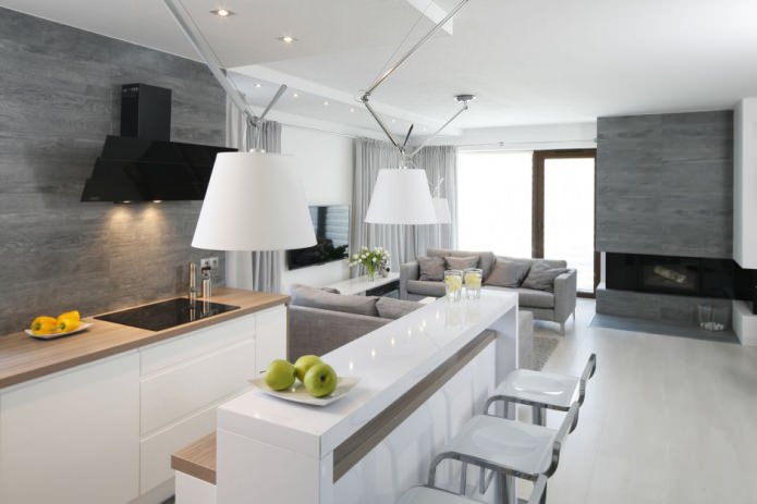 Design of a modern kitchen-living room with a bar counter