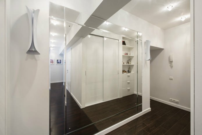 Huge mirror in a bright hallway