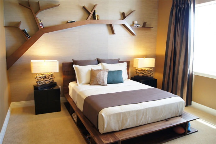 Bedroom with a wooden wall and an original shelf in the form of a tree