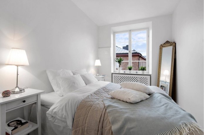small bedroom with mirror